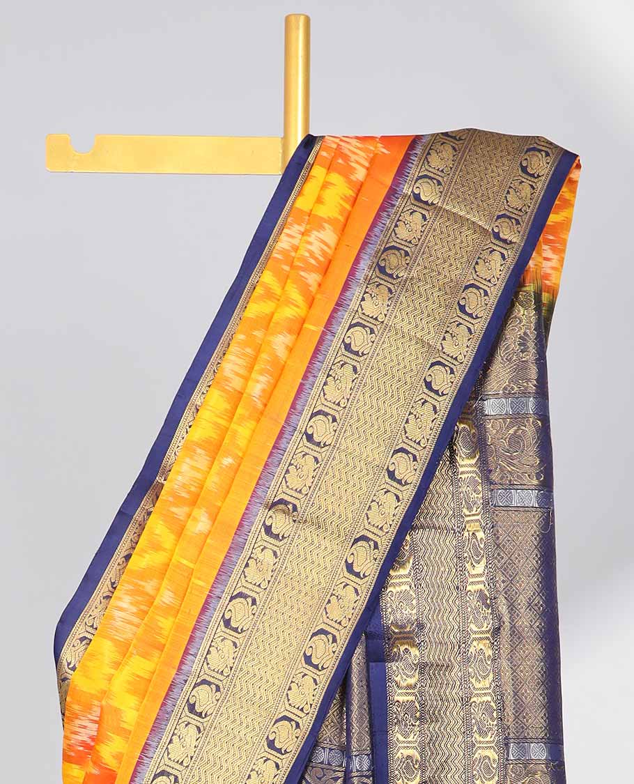 Orange ikkat style floral design soft silk saree with contrast zari border & intricate floral zari design pallu