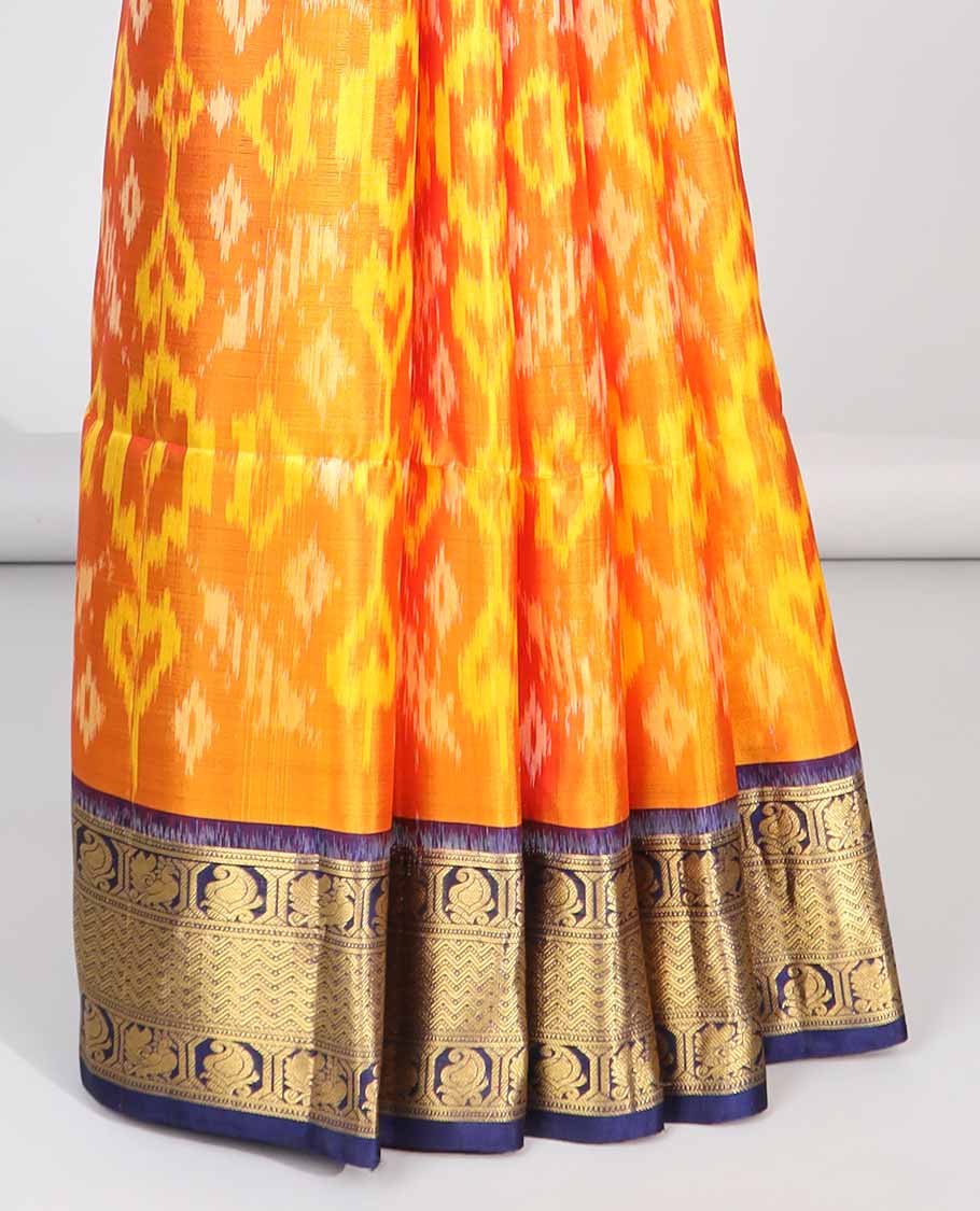 Orange ikkat style floral design soft silk saree with contrast zari border & intricate floral zari design pallu