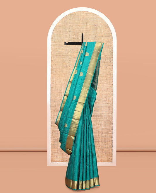 Blue Embossed Parampara Silk Saree, Features Zari Buttas, a Zari Border of Thilakam, Muthu, and Vanki Designs, Grand Pallu, and a Matching Blouse