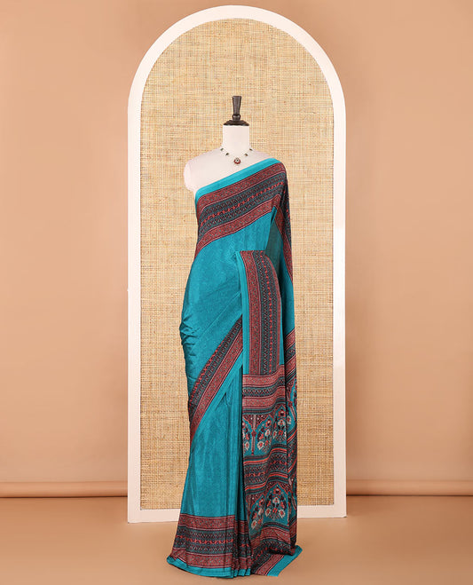 Blue negative-style sparsely printed crepe silk saree, contrast printed border, printed pallu & printed blouse
