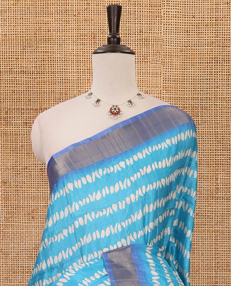 Sky blue uniquely printed soft tussar saree, contrast zari border, kalamkari floral vine printed pallu & kalamkari printed blouse