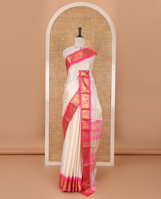 Half-white zari checked semi-taffeta silk saree, contrast rani pink annam motifs woven temple border, striped pallu & contrast striped zari border blouse