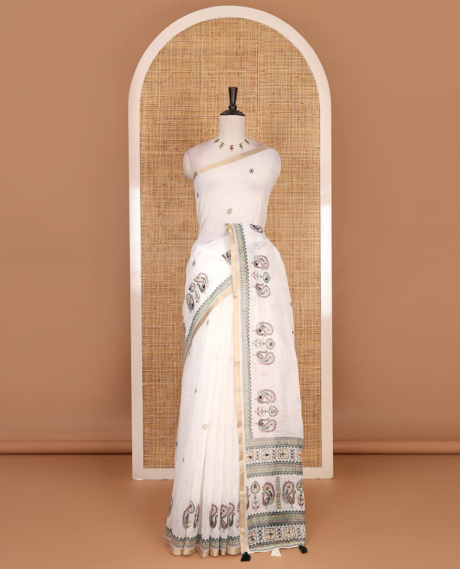 Half-white buttas with mirror work linen saree,  zari border with peacock motifs print, printed mirror work pallu, and matching blouse