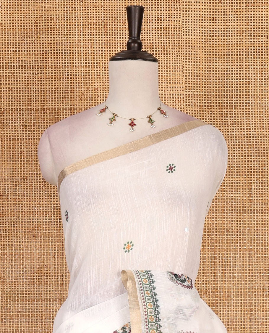 Half-white buttas with mirror work linen saree,  zari border with peacock motifs print, printed mirror work pallu, and matching blouse