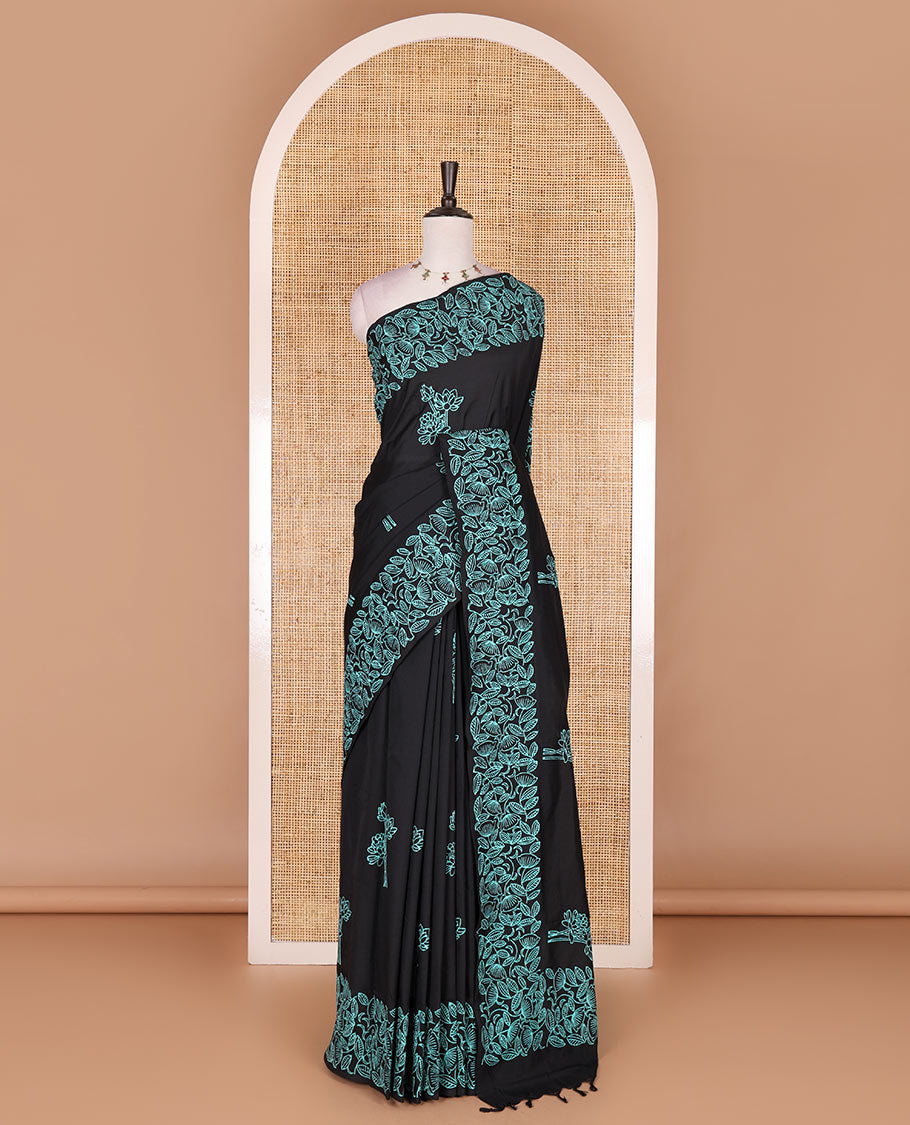 Black floral motifs hand block printed South cotton saree, floral hand block printed border and pallu, along with a contrast printed blouse