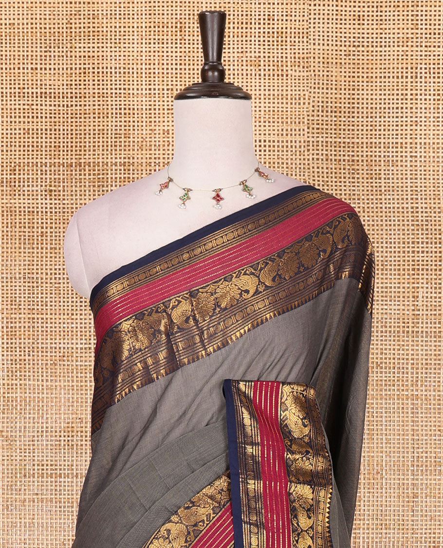 Grey plain Chettinad cotton saree, contrast rettai rettu annam and temple motif zari border, striped pallu, and matching blouse