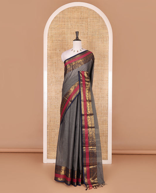 Grey plain Chettinad cotton saree, contrast rettai rettu annam and temple motif zari border, striped pallu, and matching blouse