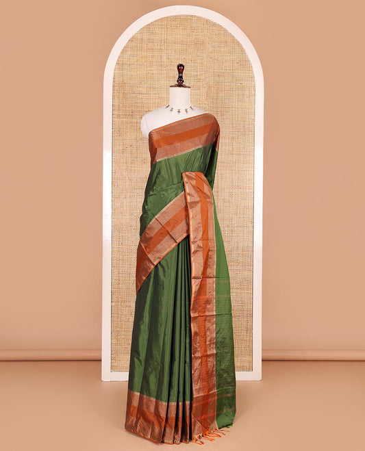 Green plain semi-soft silk saree, contrast zari striped border, striped pallu, and matching blouse