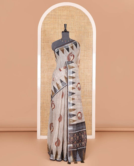 Chikku peacock motifs printed linen cotton saree, zari temple border, floral butta enclosed jaal printed pallu, and contrast buttas blouse