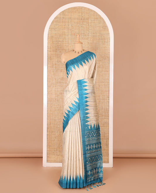 Chikku-rama green plain Khicha katan silk saree, contrast rama green temple border, ikkat printed pallu with tassels, and a contrast blouse