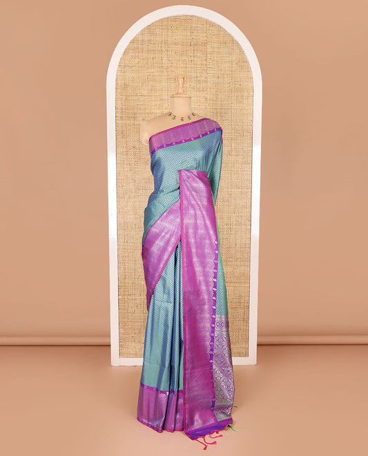 Blue small zari buttas woven elite soft silk saree, contrast zari woven scallop satin border, jaal pallu, and a contrast chakram zari motifs blouse