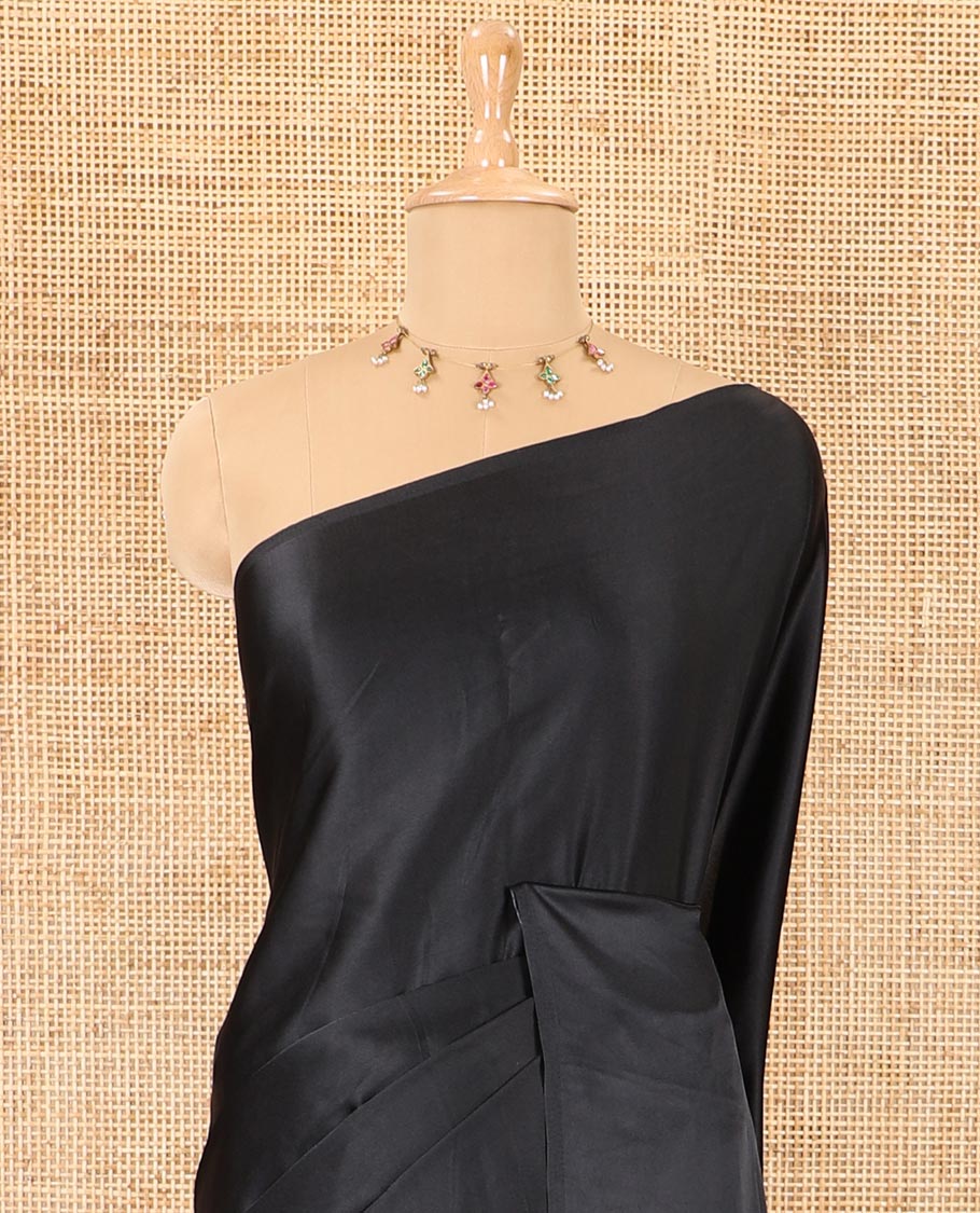 Borderless black-red half-and-half style, intricately Ajrakh printed satin crepe saree with a contrast lotus floral printed blouse