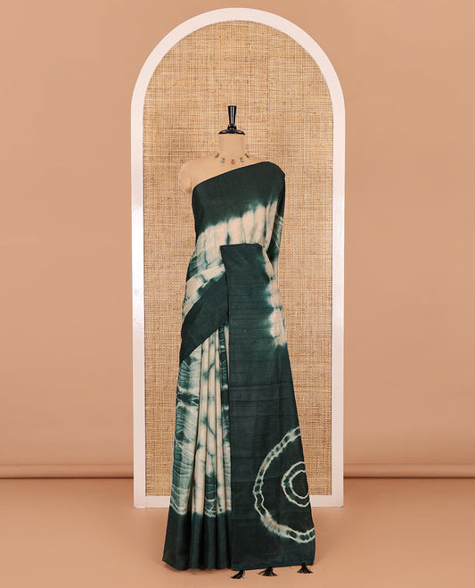 Rama green shibori printed jute cotton saree, contrast plain border, plain pallu with tussels, and contrast plain blouse