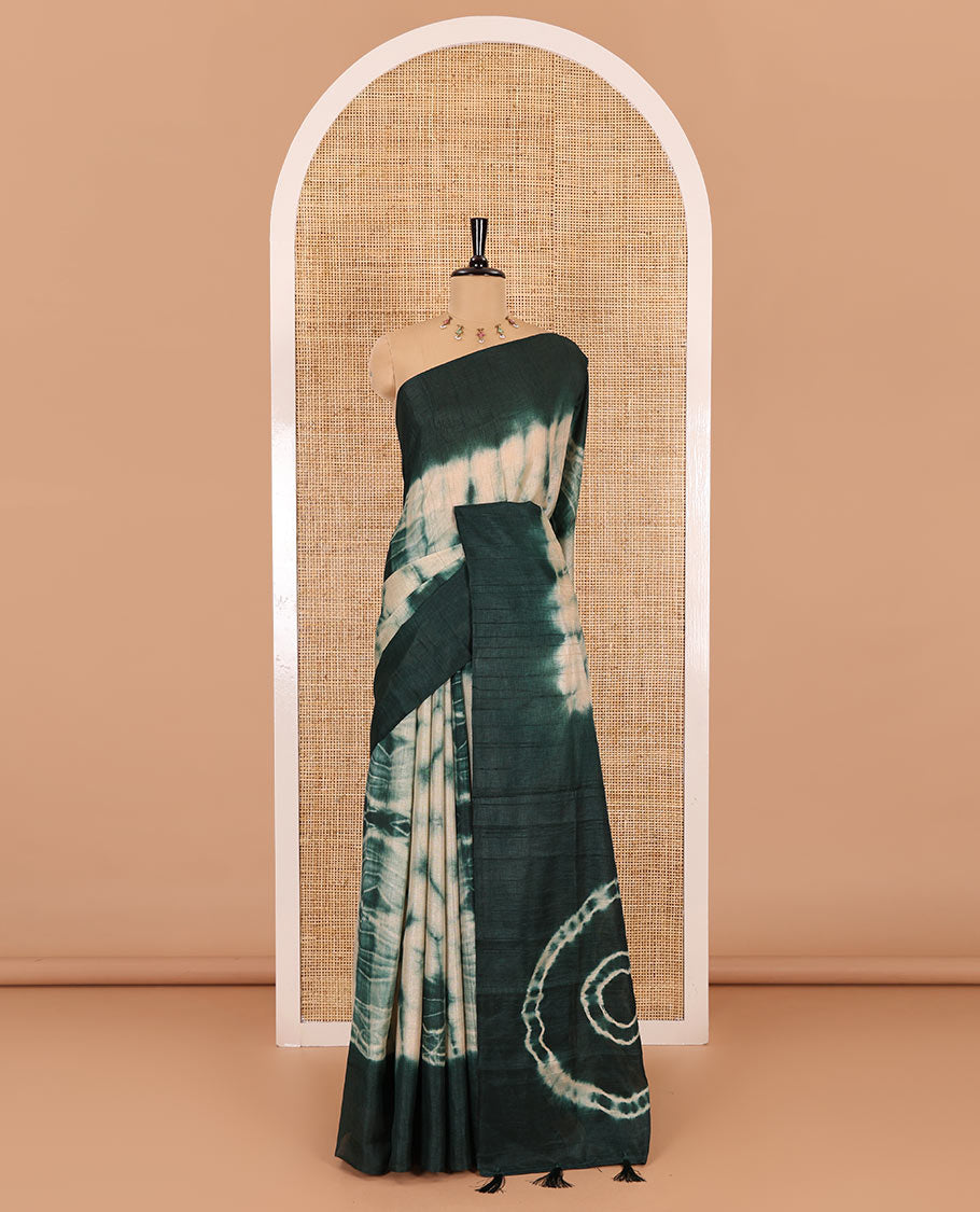 Rama green shibori printed jute cotton saree, contrast plain border, plain pallu with tussels, and contrast plain blouse