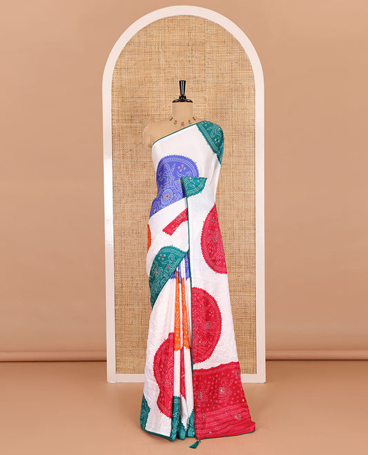 White base multi-color bandhani dots enclosed circle printed with mirror work moss chiffon saree, contrast piping border, pallu of print, stone work and mirror work