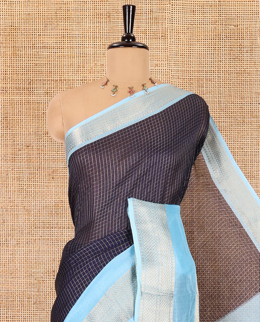 Navy blue checked moss chiffon saree, contrast traditional zari rettai pettu border, striped pallu, and a contrast zari design blouse