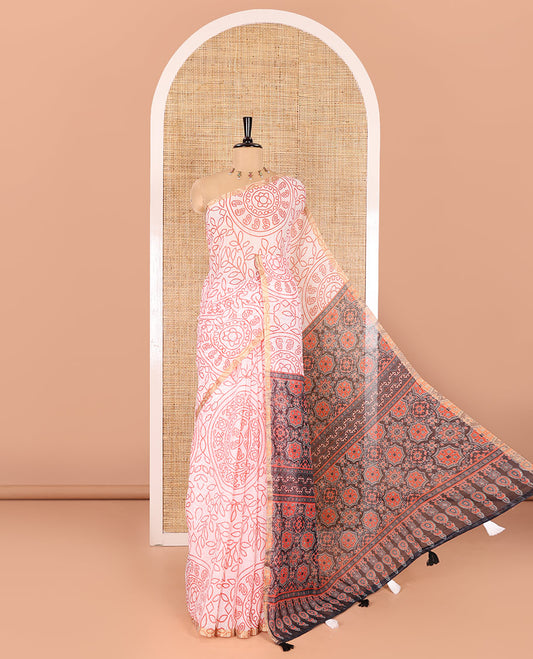 white bandhani-style floral and chakra printed saree, zari piping border, contrast ajrakh printed pallu, and contrast ajrakh printed blouse