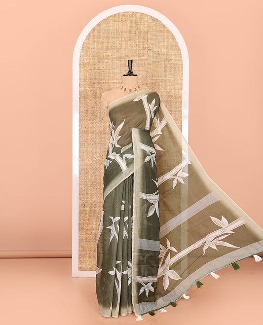 Olive green bamboo motifs printed chanderi cotton saree, contrast plain border, bamboo motifs printed pallu, and a contrast unique motifs printed blouse
