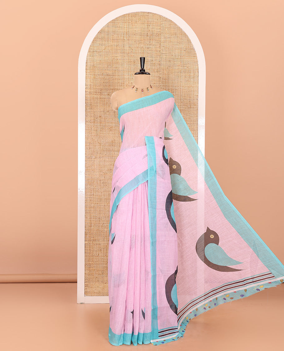 Baby pink motifs linen cotton saree with contrast plain border , birds mofits pallu and leaf printed blouse