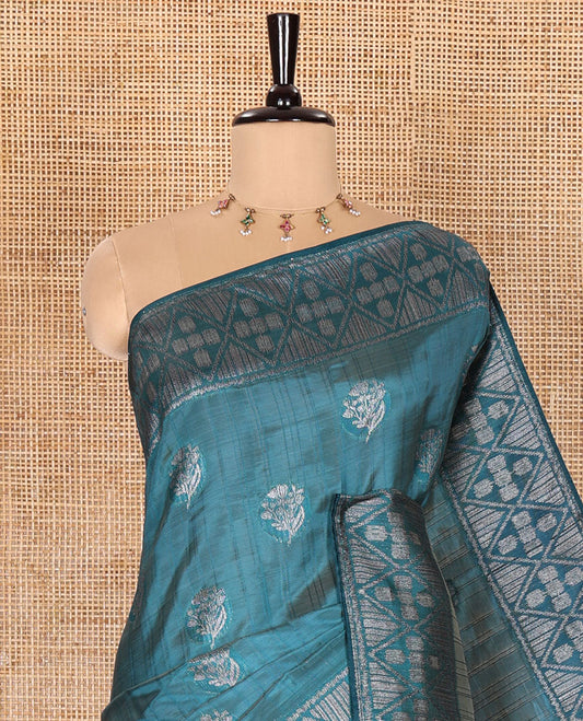 Blue Semi-Tussar Saree Subtly Woven With Floral Zari Buttas, Featuring a Geometric-Patterned Zari Border, Adorned With a Butta-Enclosed Checked Pallu, and a Matching Blouse