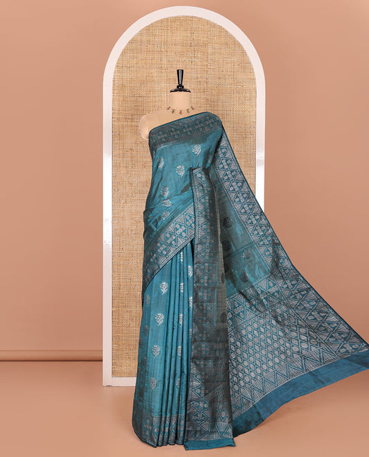 Blue Semi-Tussar Saree Subtly Woven With Floral Zari Buttas, Featuring a Geometric-Patterned Zari Border, Adorned With a Butta-Enclosed Checked Pallu, and a Matching Blouse