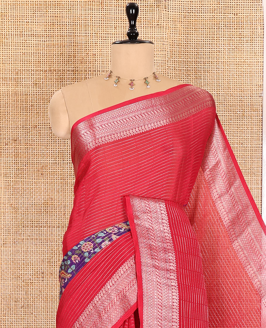 Rani Pink Viscose Georgette Adorned with Horizontal Zari Stripes and Kalamkari Flora-Paisley Prints, Complemented by a Traditional Zari Border, a Printed Pallu with Stripes, and a Matching Blouse
