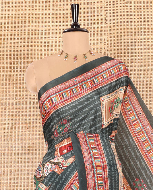 Bottle Green Masakali Saree Featuring Leaf Vine and Mughal-Style Motifs Print and Mirror Work, Kaleidoscopic-Colored Printed Border, Pallu Adorned with Colorful Intricate Pattern Print, and a Matching Blouse