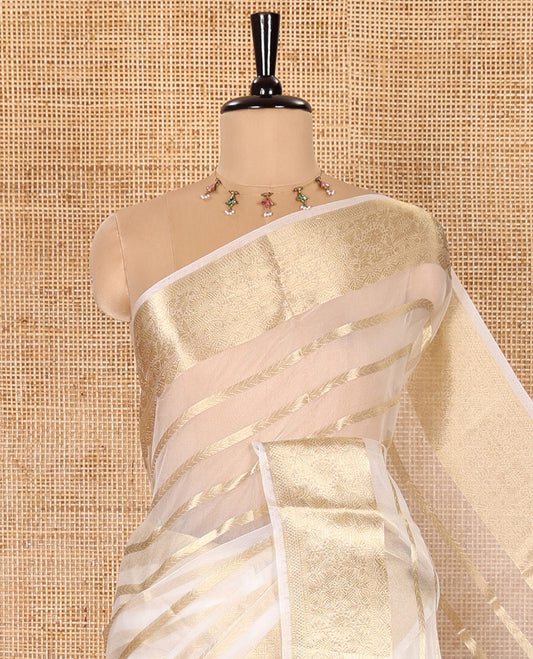 Entralling White Semi-Organza Saree Embellished with Zari Designs, Subtly Sparked with Traditional Zari Design Border, Zari-Striped Pallu, and Paired with a Matching Zari Design Blouse