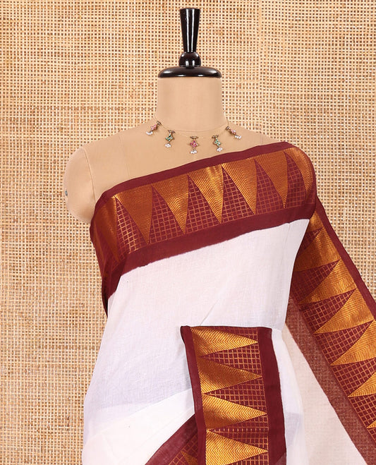 Off-White and Maroon Plain Sungudi Cotton Saree Accentuated with a Contrast Border of Temple and Zari Checks Designs, Subtly Zari Striped Pallu, and Paired with a Contrast Blouse