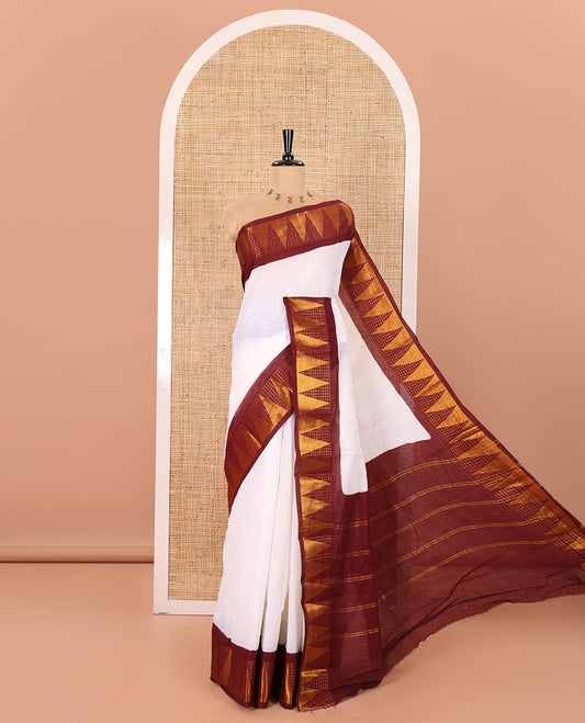 Off-White and Maroon Plain Sungudi Cotton Saree Accentuated with a Contrast Border of Temple and Zari Checks Designs, Subtly Zari Striped Pallu, and Paired with a Contrast Blouse