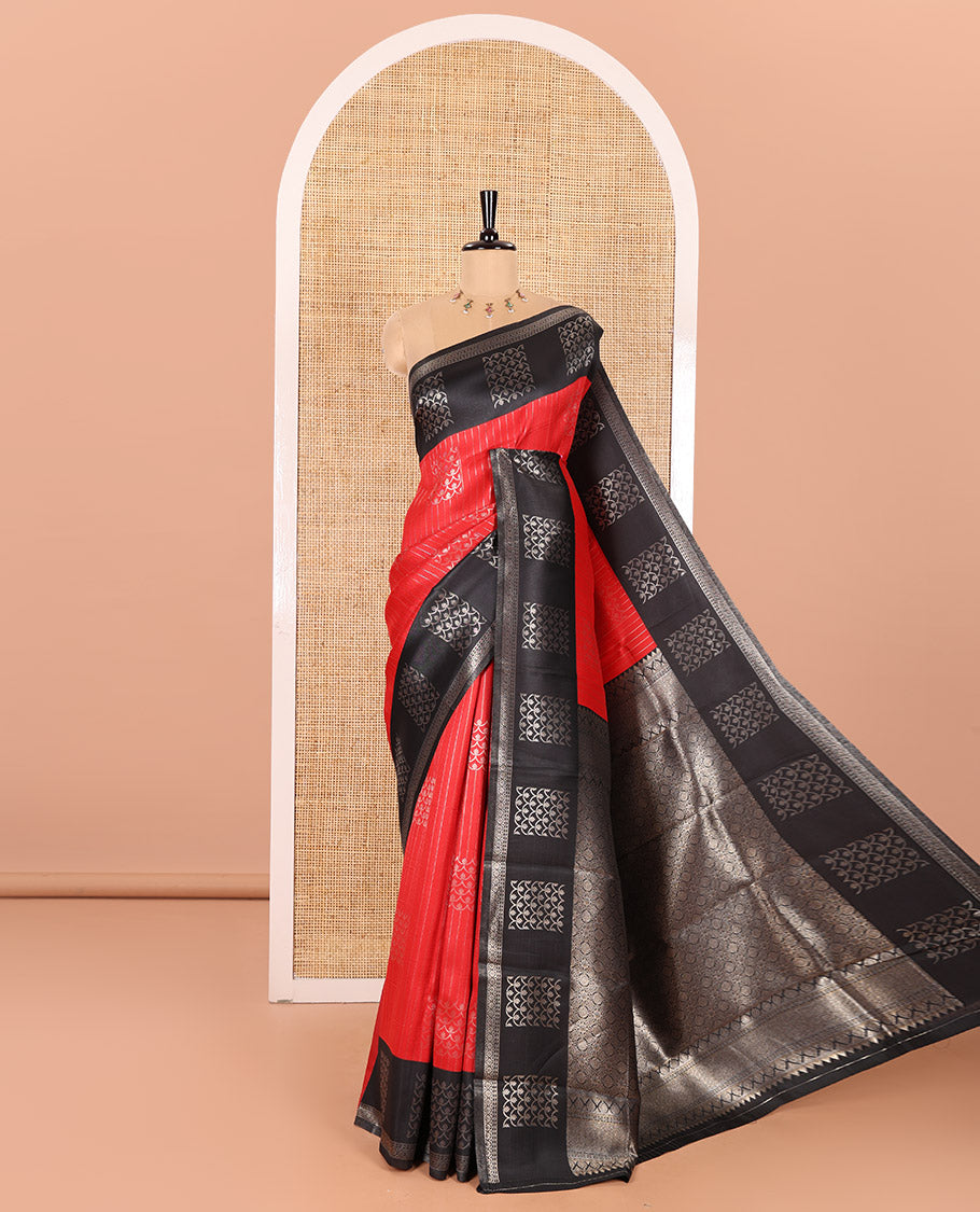 Red Kanchi Silk Saree Highlighted by Zari Stripes and Scallop Buttas All Over Its Body, Complemented by Contrast Border of Zari Designs, Gracefully Embellished Pallu of Intricate Designs, and Paired with a Contrast Blouse