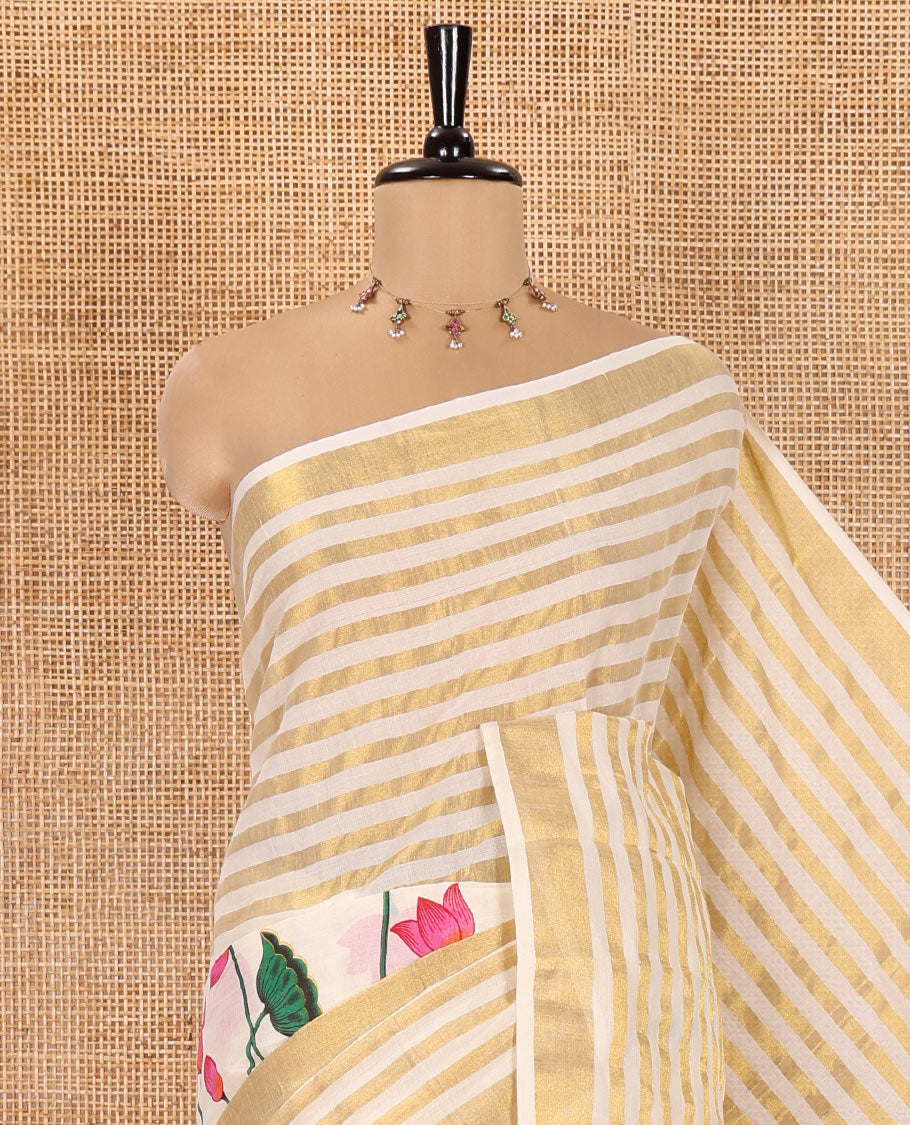 Cream Kerala Cotton Saree, Gleamed Up with Horizontal Zari Stripes and Pichwai Lotus Print All Over Its Body, Subtle Zari Border, Pallu Mirrors Pichwai Lotus Print, and Paired with a Matching Blouse