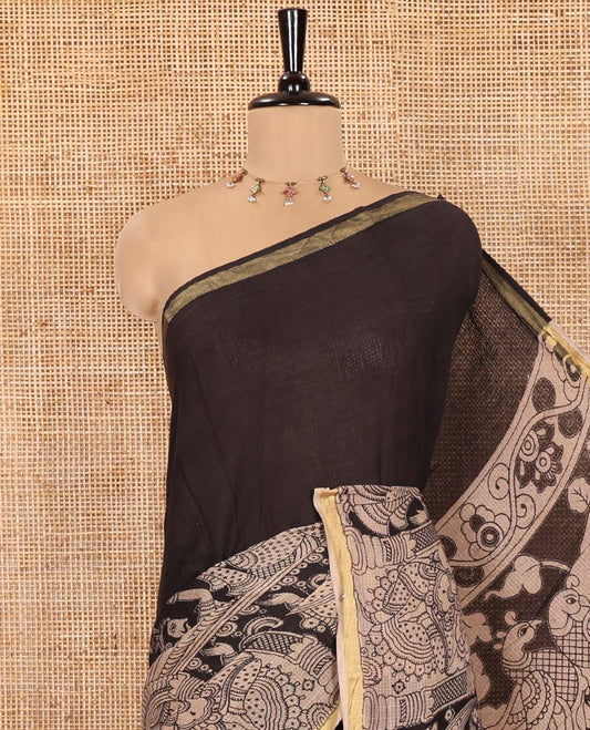 Black Kota Cotton Saree, Artfully Decked Up with Kalamkari-Style Human Figurines Printed on the Body, Subtle Piping Border, Pallu Pictures Kalamkari-Style Flora-Fauna Motifs, and Paired with a Contrast-Printed Blouse