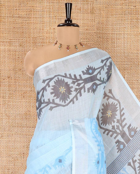 Blue Plain Linen Cotton Saree, Subtly Sparkled Zari Border of Jamdani-Style Leaf-Floral Designs, Pallu Depicting Jamdani-Style Designs, and Paired with a Matching Blouse