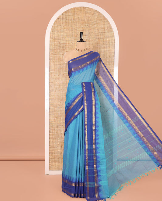 Blue Chettinad Cotton Saree, Subtly Sparkled with Thread Buttas All Over Its Body, Complemented by a Contrast Border Rettai Pettu Border of Paisley and Chevron Stripes, Subtly Designed Pallu, and Paired with a Matching Blouse