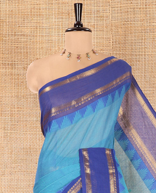 Blue Chettinad Cotton Saree, Subtly Sparkled with Thread Buttas All Over Its Body, Complemented by a Contrast Border Rettai Pettu Border of Paisley and Chevron Stripes, Subtly Designed Pallu, and Paired with a Matching Blouse