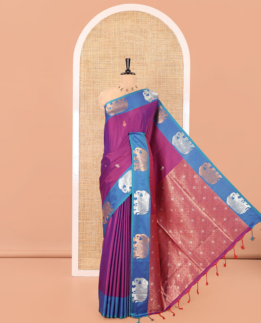 Purple Soft Silk Saree, Accentuated With Zari Buttas All Over Its Body, Complemented by Captivating Contrast Border of Elephant Motifs, Grandly Decked Up Pallu, and Paired with a Contrast Blouse
