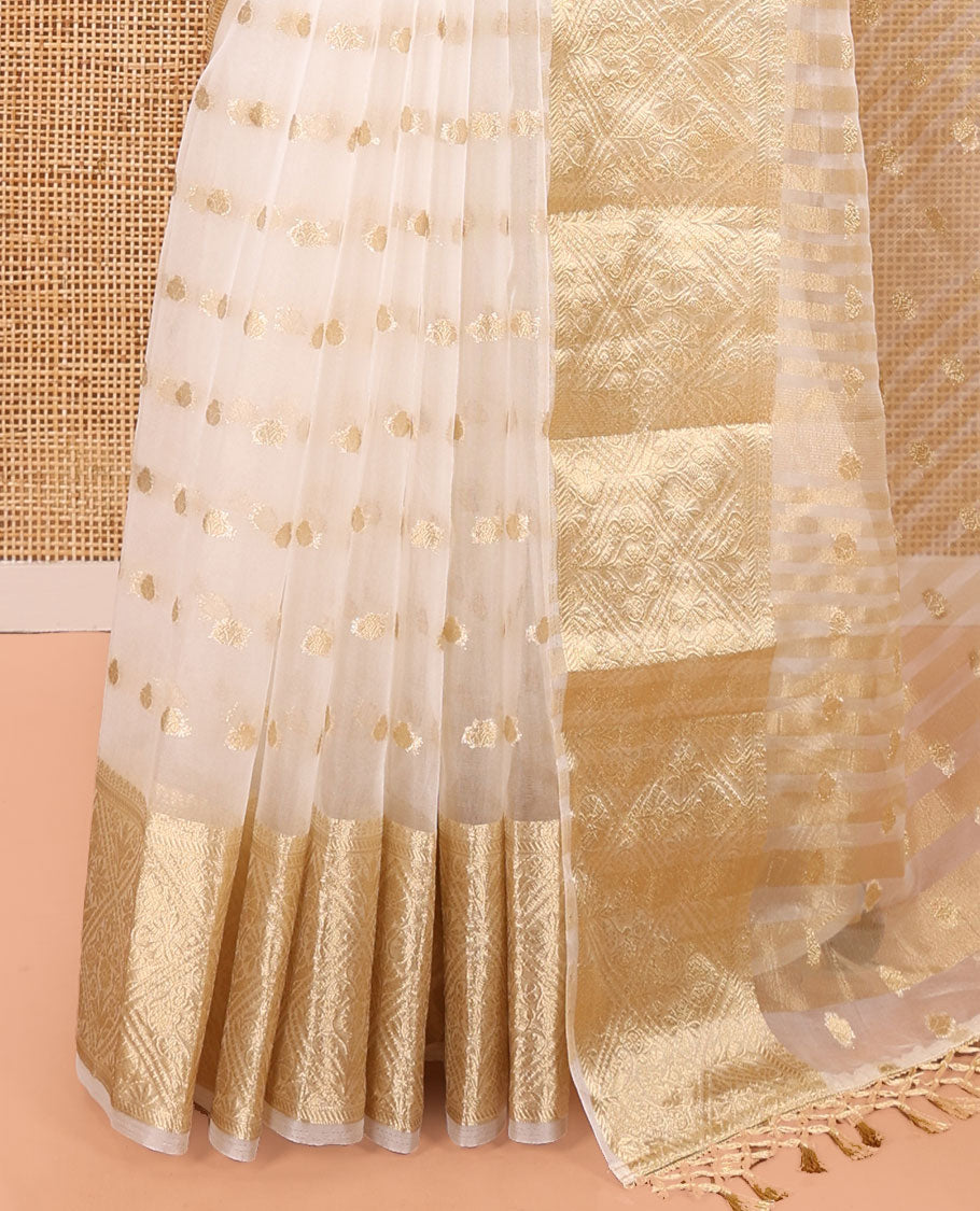 Cream Semi-Organza Saree, Mesmerized with Zari Buttas All Over Its Body, Highlighted by a Zari Jaal-Patterned Border, Gleaming Zari Design Pallu, and Paired with a Matching Blouse