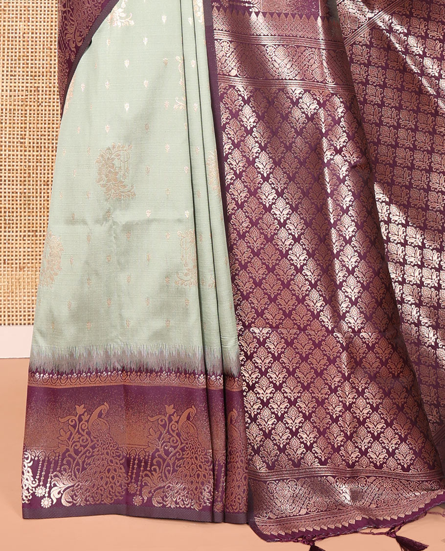 Pista Green Elite Soft Silk Saree, Featuring Zari Buttas on Its Body, Complemented by a Contrast Peacock-Floral Zari Blouse, Intricately Designed Pallu, and Paired with a Contrast Blouse