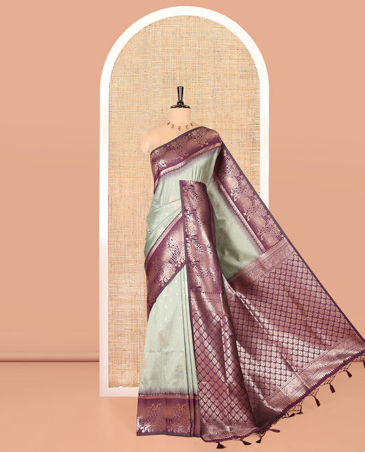 Pista Green Elite Soft Silk Saree, Featuring Zari Buttas on Its Body, Complemented by a Contrast Peacock-Floral Zari Blouse, Intricately Designed Pallu, and Paired with a Contrast Blouse