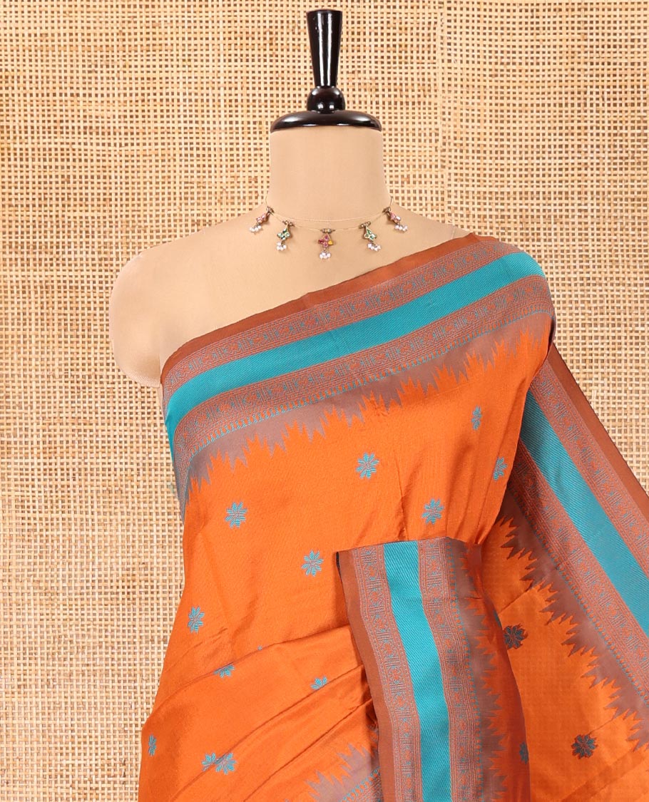 Rust Orange Kanchi Silk Saree, Woven with Floral Thread Buttas All Over Its Body, Complemented by a Contrast Border of Temple Traditional Motifs, Jaal Pallu, and Paired with a Matching Blouse
