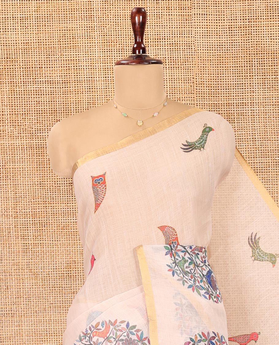 Cream Linen Cotton Saree, Steeped in the Richness of Nature-Themed Motifs Like Bird, Owl, and Tree, a Subtle Piping Border, Pallu of Tree Motifs, and Paired with a Matching Blouse