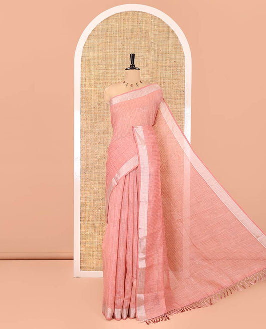 Peach Linen Zari Cotton Saree, Gleamed Up with Zari Stripes All Over Its Body, a Subtle Zari Border, a Self-Pallu, and Comes Without a Blouse