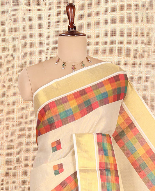 Gold-Purple Kerala Tissue Cotton Saree Features Madras Checked Buttas, a Zari Checked Border, and a Contrast Blouse