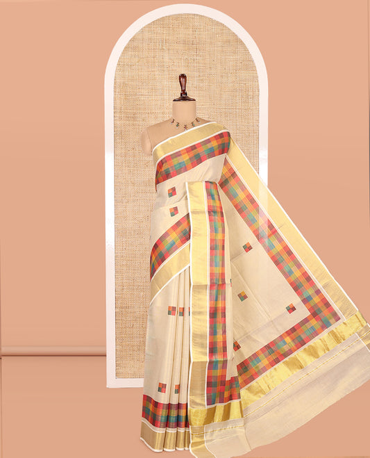 Gold-Purple Kerala Tissue Cotton Saree Features Madras Checked Buttas, a Zari Checked Border, and a Contrast Blouse