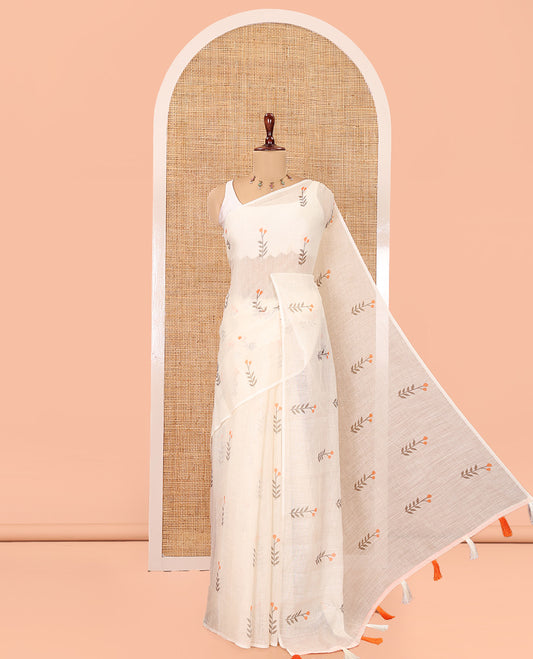 Borderless Cream-Orange Linen Cotton Saree, Prettified with Floral Buttas, a Self-Pallu, and a Contrast Blouse