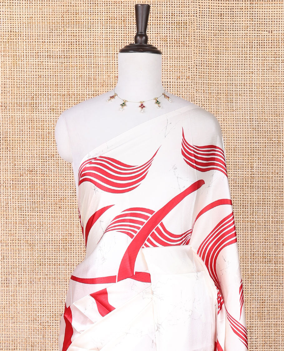 Borderless cream with red floral design modal crepe saree with floral printed pallu along with plain blouse