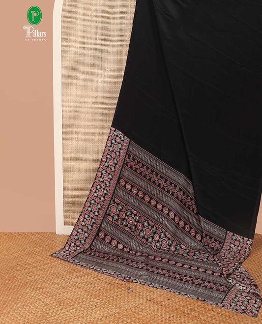 Borderless black turkey crepe saree with ajrakh printed pallu & printed blouse