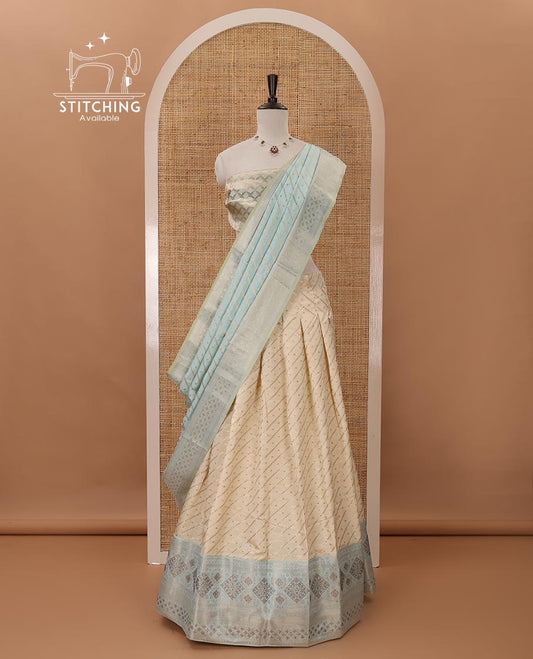 Cream semi-banaras material chudidar,leheriya zari skirt,contrast sea blue zari & swarovski stonework border,jacquard blouse & zari weave dhavani