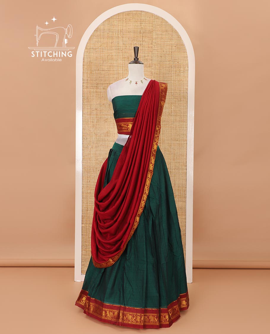 Green mercedised cotton half-saree, plain contrast elephant zari border skirt, matching blouse & contrast maroon zari elephant border dhavani